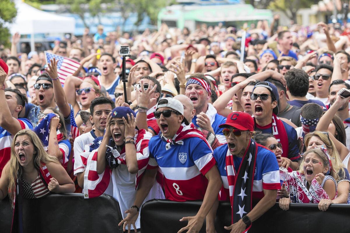 Fans react as the U.S. soccer team takes on Belgium in the World Cup. They were at a viewing party at Redondo Beach Pier. Belgium won 2-1 in extra time.