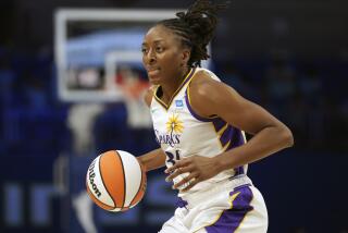 Los Angeles Sparks forward Nneka Ogwumike dribbles during the second half of a WNBA basketball game.
