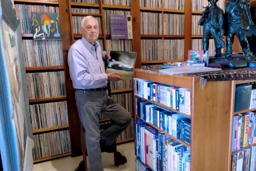 Bram Dijkstra is shown with part of his 50,000-strong collection of rare jazz.
