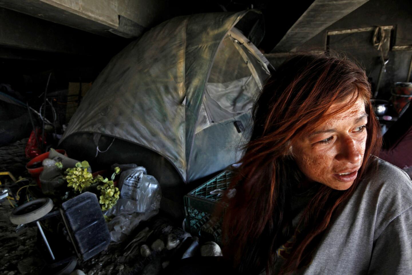 Diane Asebedo, 41, who says she's been homeless off and on for nine years, is visited by the outreach team.