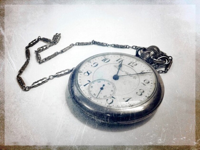 Photo Illustration of an antique pocket watch.