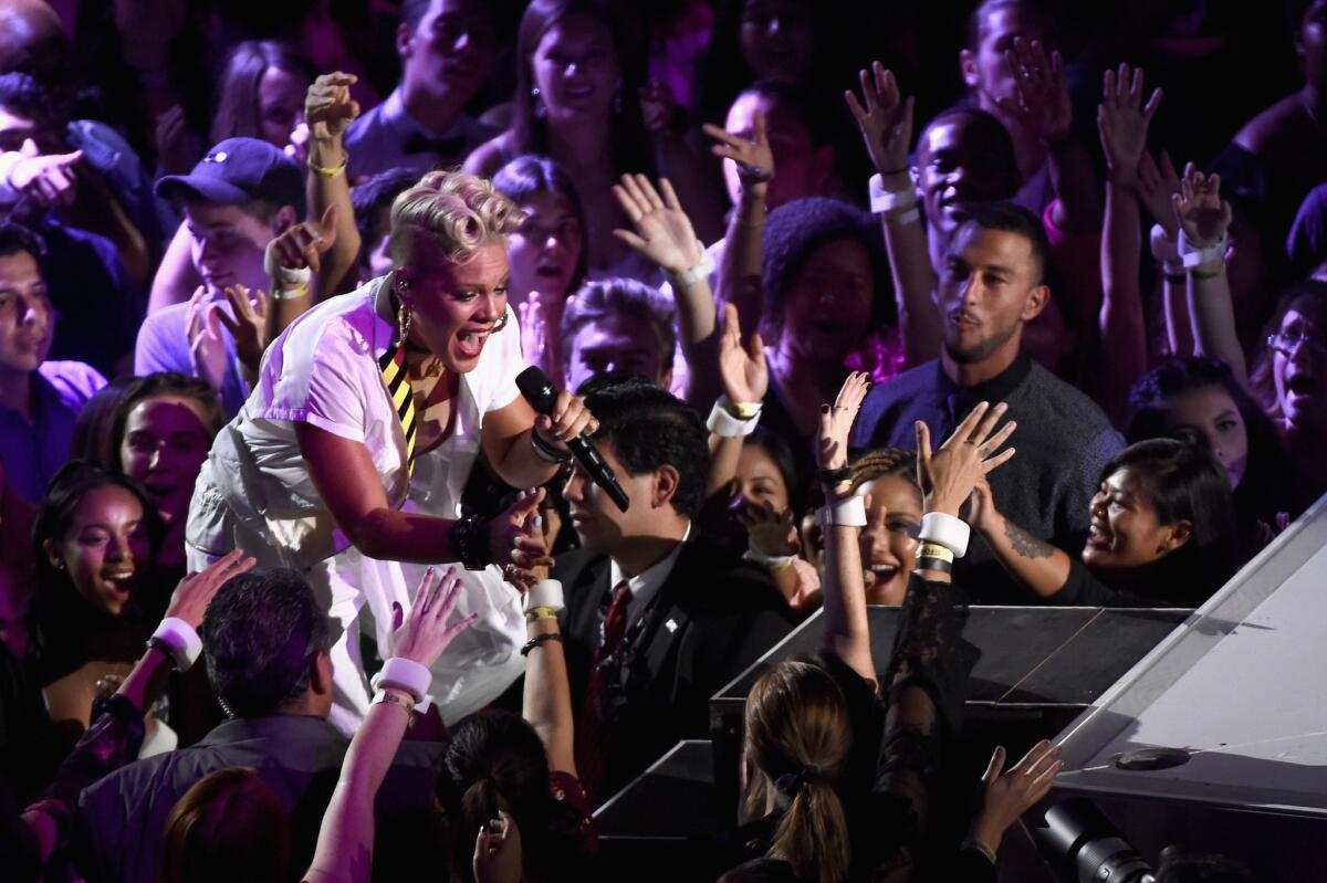 Pink interacts with the crownd during her performance.