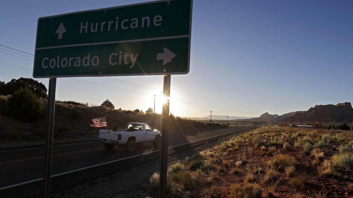 A motorist drives down State Route 59 in Colorado City, Ariz., a town once ruled by Warren Jeffs, the leader of the Fundamentalist Church of Jesus Christ of Latter-day Saints.