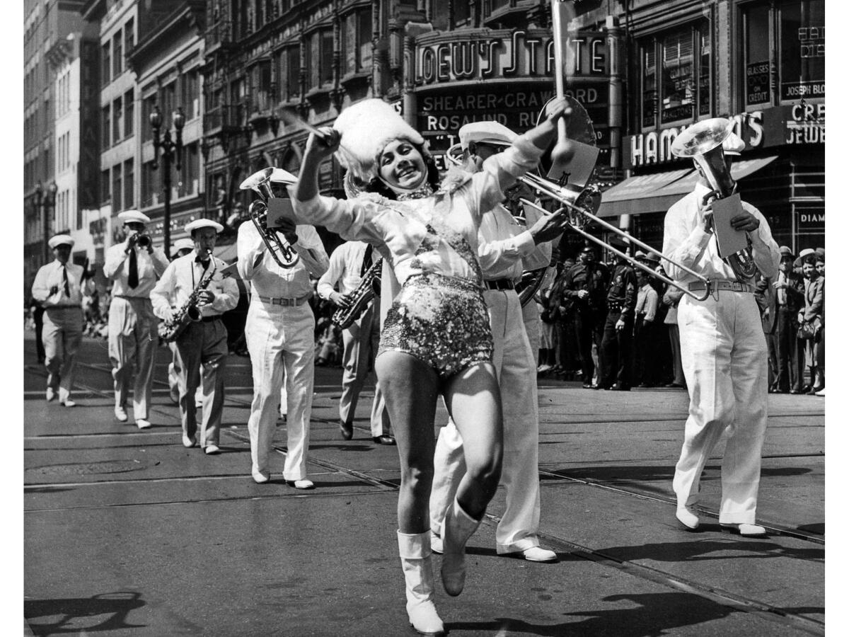 Sept. 4, 1939: A majorette leads a band at 7th and Broadway during the 1939 Labor Day parade.