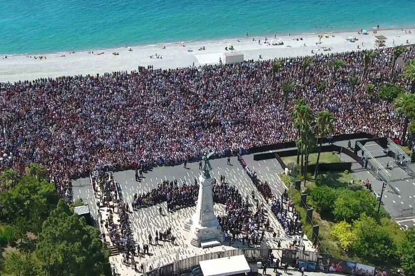 Thousands gather on Monday on the Jardin Albert and the Promenade des Anglais in Nice to observe a minute of silence for victims of the deadly attack.