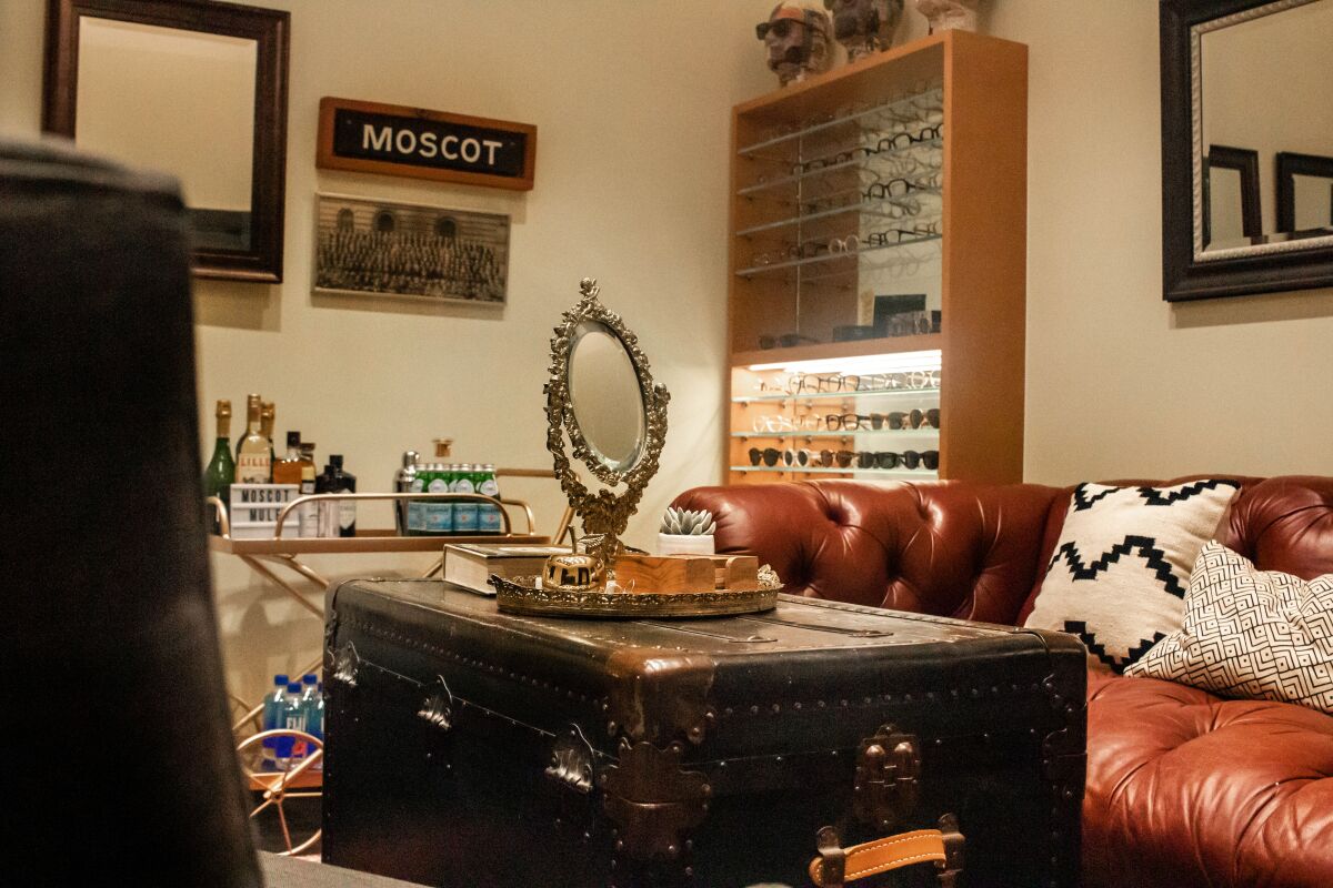A look at the interior of Moscot's L.A. store. Inside the space, there's a spot for clients who prefer a discreet shopping experience, accessible by private entrance and stocked for anyone in need of a mid-purchase drink.