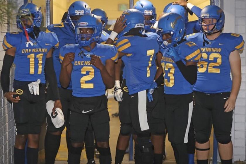 Crenshaw players prepare to take the field last week against Whittier Christian. 