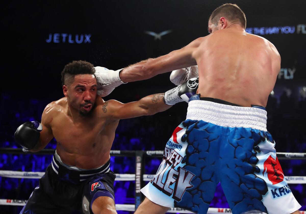 Andre Ward ducks a punch and goes to the body of Sergey Kovalev during their light-heavyweight title fight on Saturday night in Las Vegas.