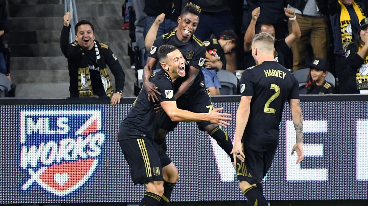 LAFC's Christian Ramirez, left, celebrates his goal early in the second half against.