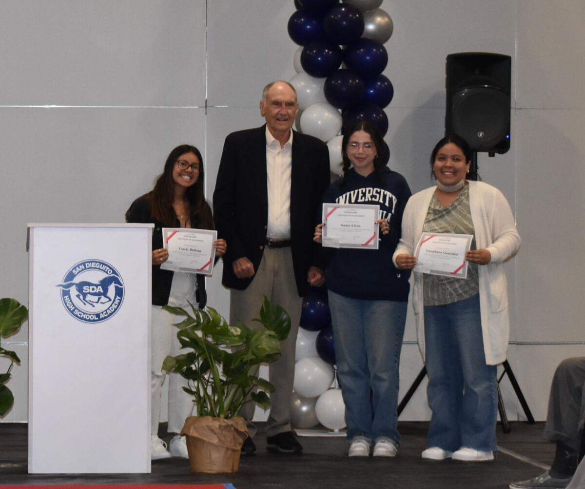 Bill Berrier, former superintendent of SDUHSD, and recipients of the Berrier Scholarship for future educators.