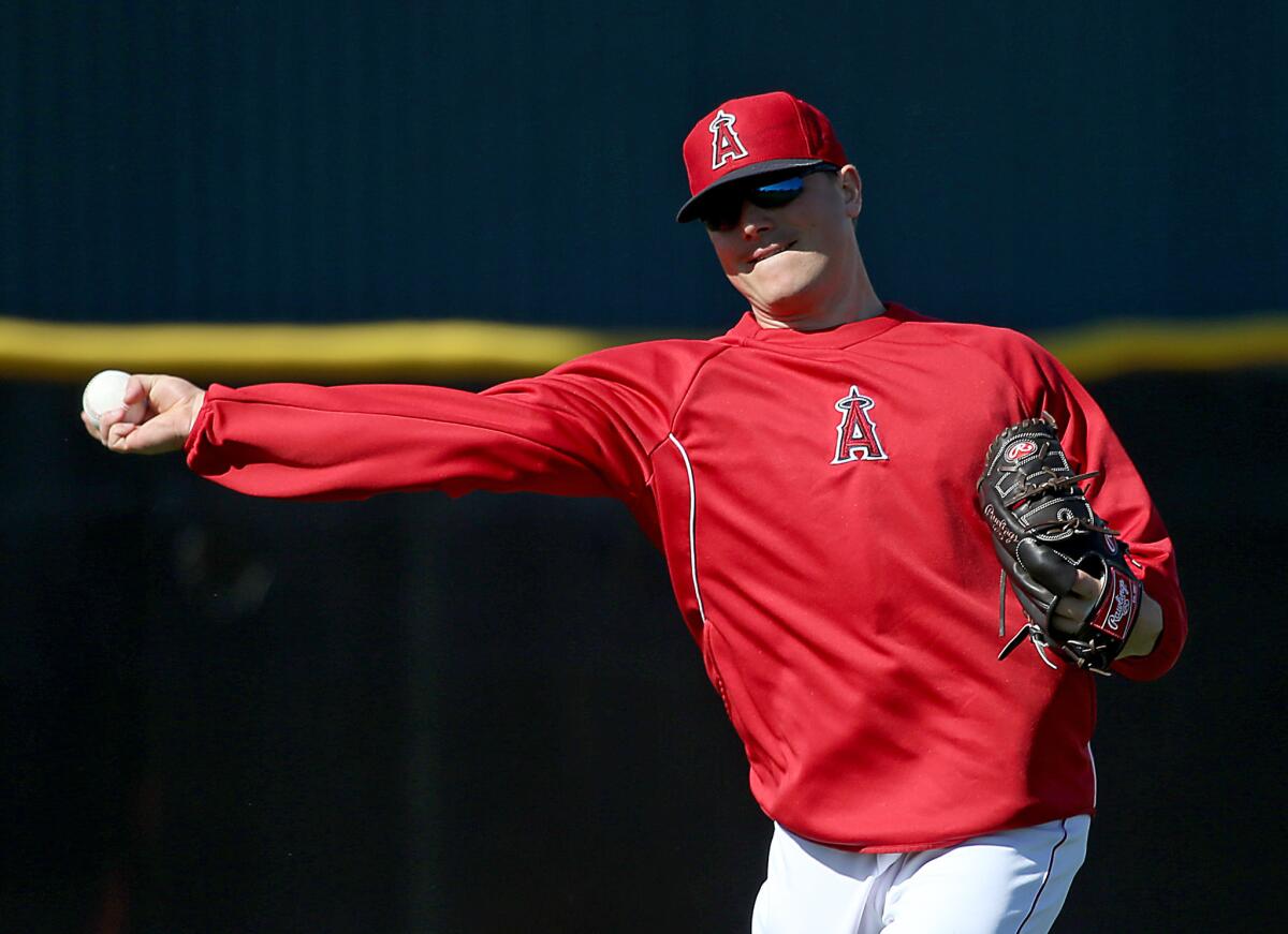 Angels pitcher Joe Smith warms up with his unique sidearm delivery.