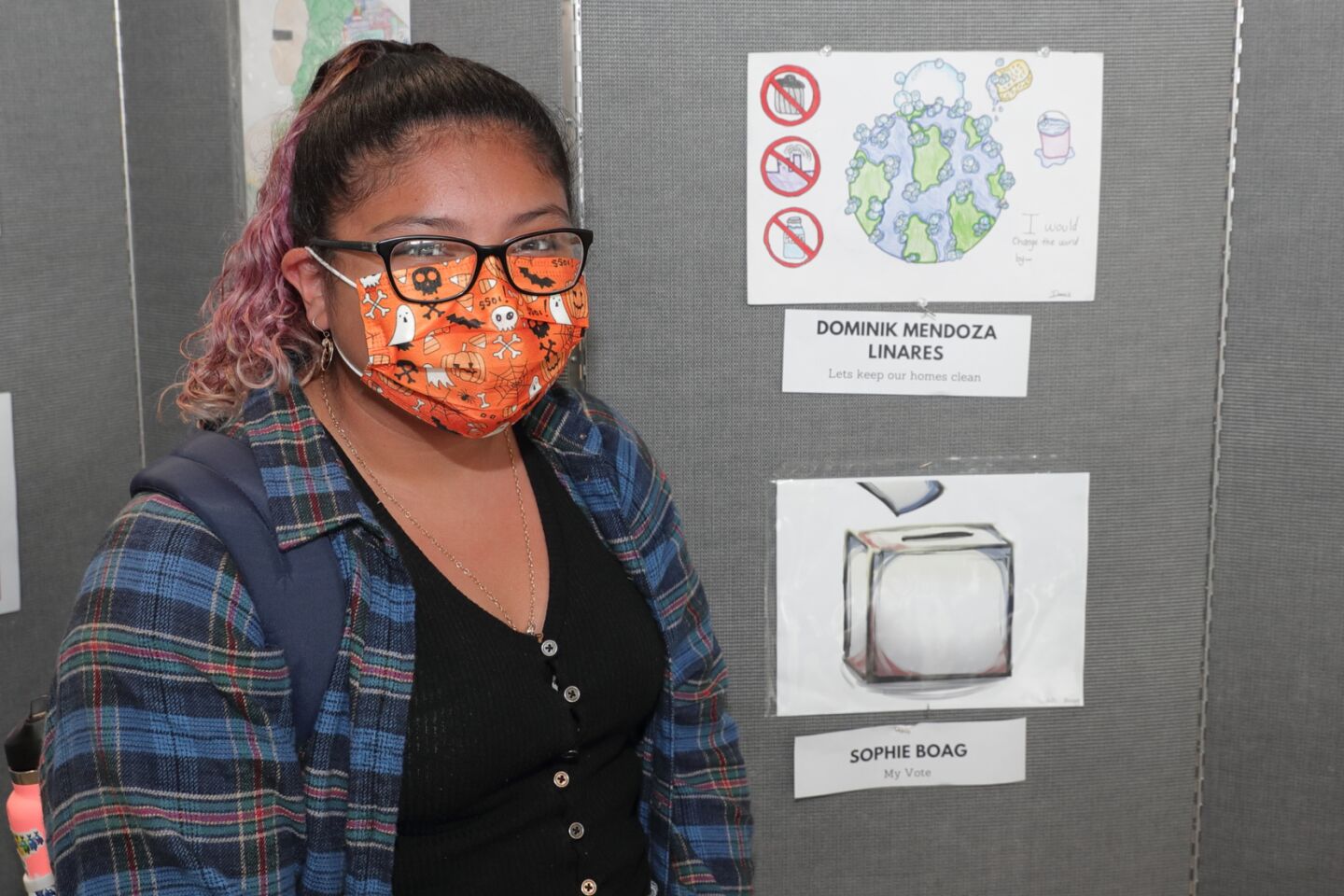 Dominik Mendoza LInares with her entry "Let's Keep Our Homes Clean"