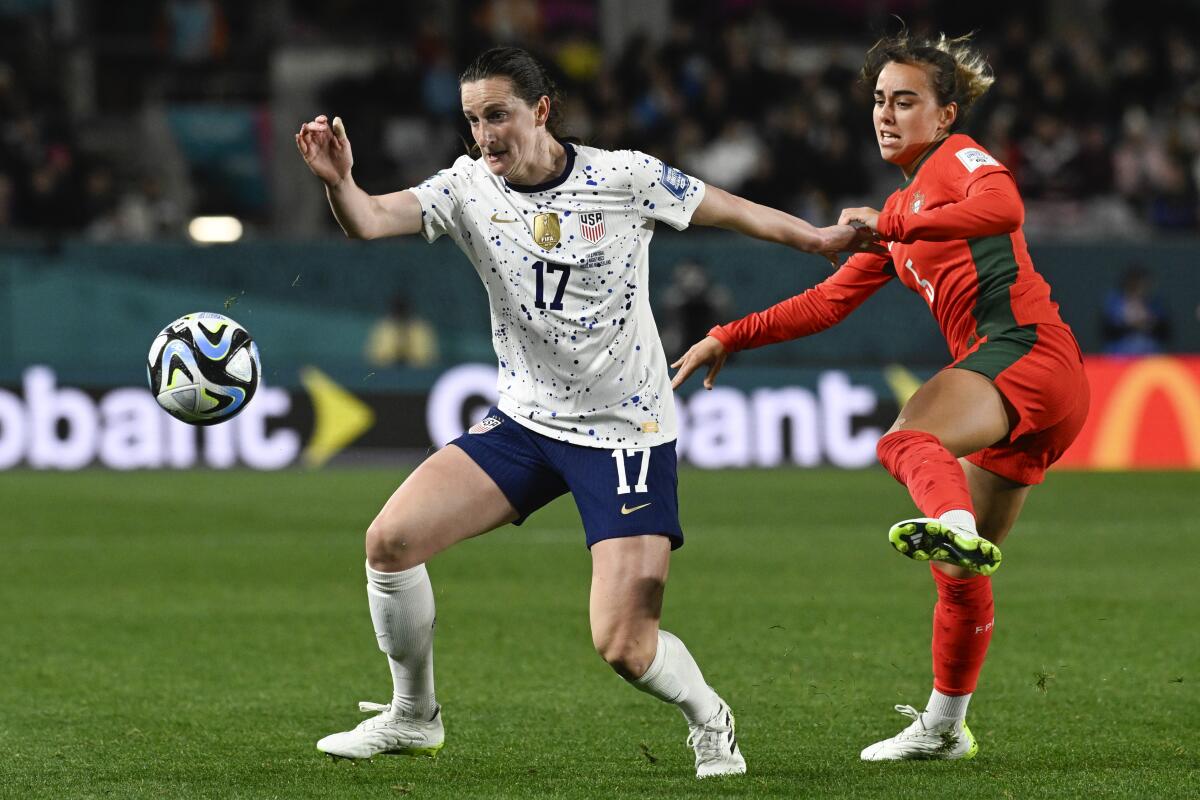 Andi Sullivan, left, and Portugal's Joana Marchao battle for the ball.