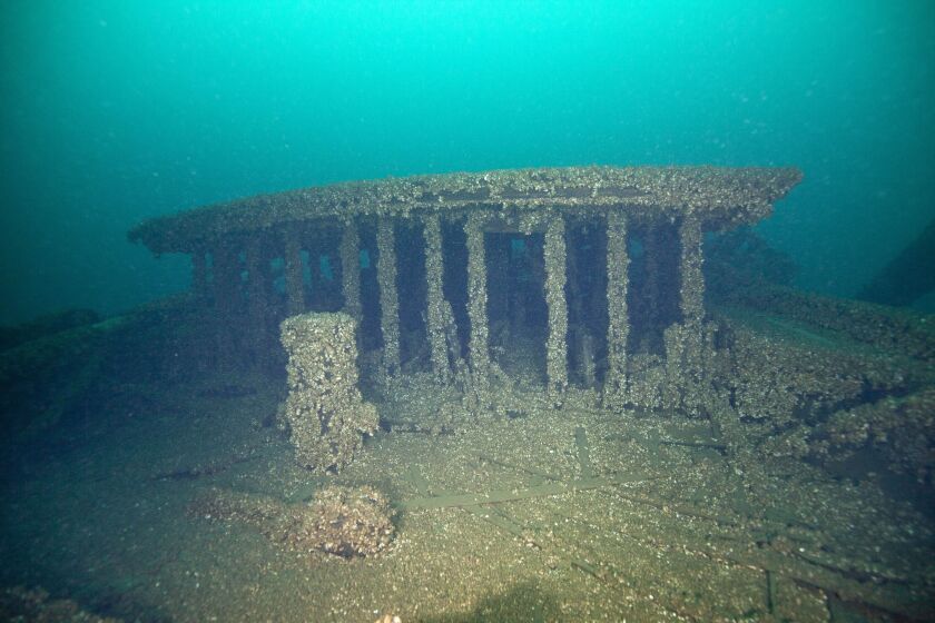 This Aug. 24, 2019, photo provided by John Janzen, shows part of the wreckage of the schooners Peshtigo and St. Andrews, lost in 1878 near Beaver Island in northern Lake Michigan. A group of maritime history enthusiasts led by Boyne City, Michigan diver and explorer, Bernie Hellstrom have announced the discovery of the schooners. The site was located in 2010 by Hellstrom during one of his many trips to explore the Beaver Island archipelago. (John Janzen via AP)