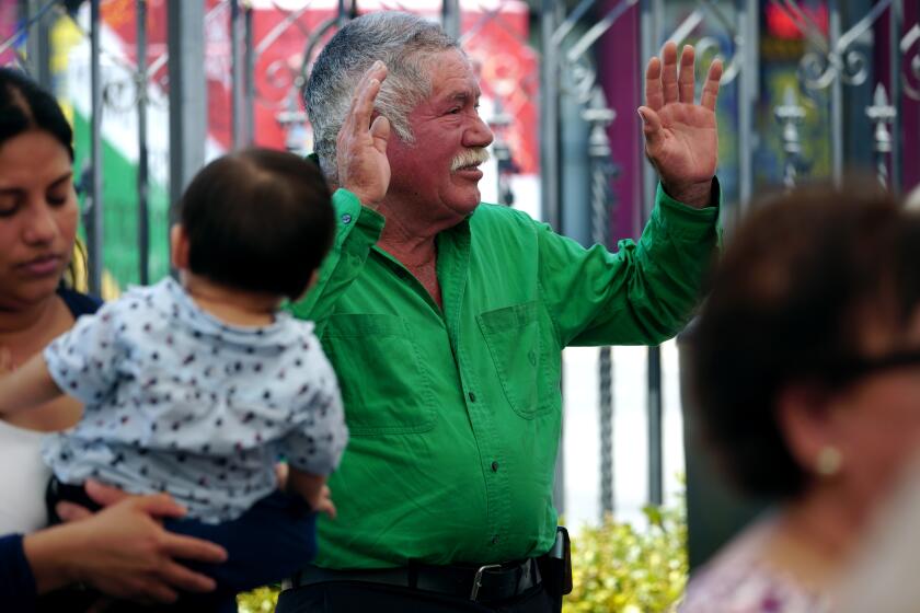 Before he begins selling ice cream, Jose Villa, 72 of L.A., prays during Sunday service at Iglesia Pentecostal Esmirna, in the Highland Park area of Los Angeles on Sunday, July 1, 2023. Villa, originally from Sinaloa, Mexico, has been selling ice cream for eight years after being laid off from a pizzeria. Villa has been in the United States since 1996 and continues working since he is not eligible to receive government financial benefits because of his legal status.