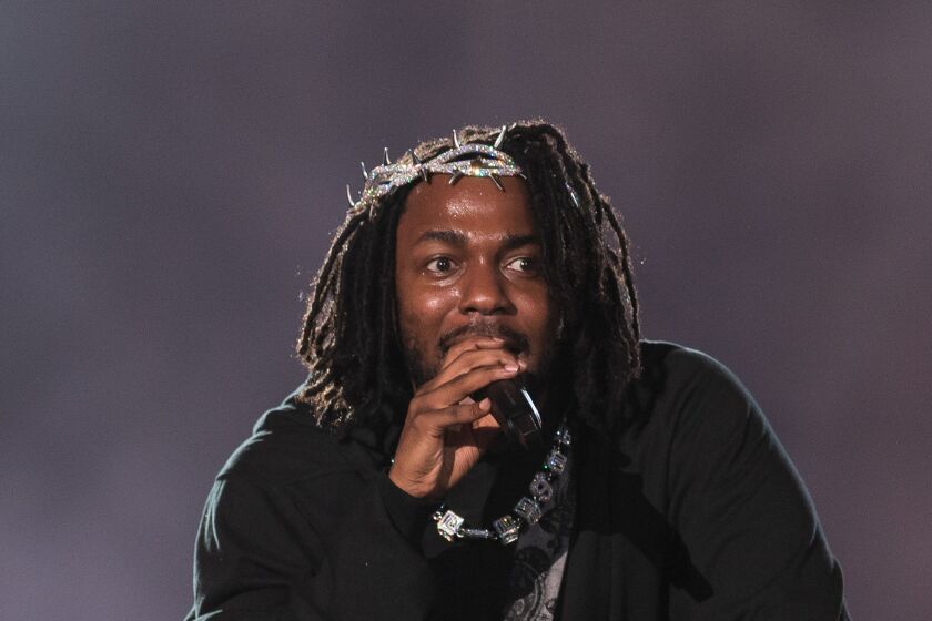 Kendrick Lamar performs onstage. (Photo by Jason Koerner/Getty Images)