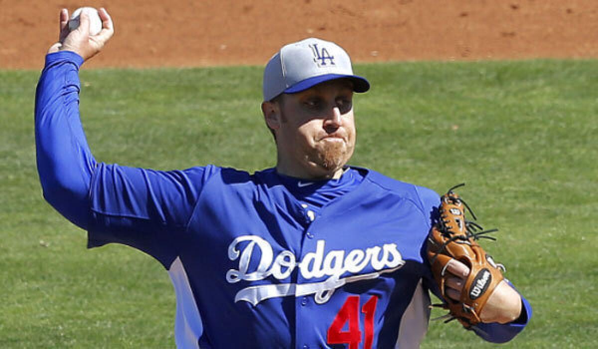 Aaron Harang, shown during a spring training game, is one of several pitchers vying for precious few spots in the Dodgers' rotation.