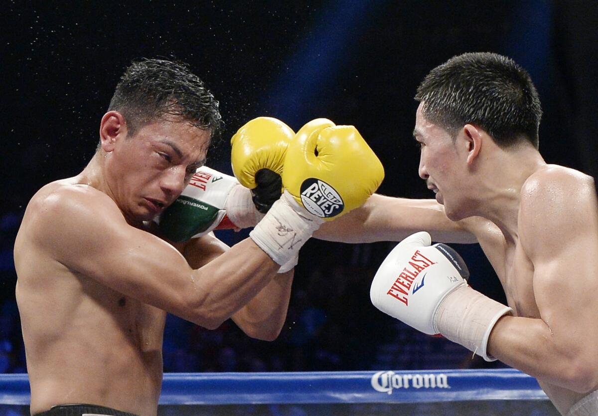 Leo Santa Cruz, right, lands a punch on Cristian Mijares during a WBC super-batamweight title bout at the MGM Grand Garden Arena on March 8.