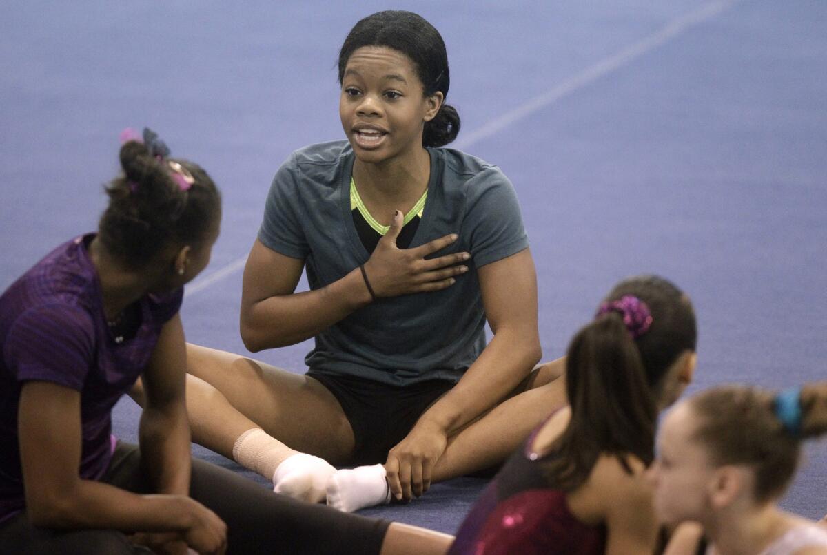 U.S. Olympic gold medalist Gabby Douglas stretches before a workout at the Karolyi Ranch in New Waverly on July 2.
