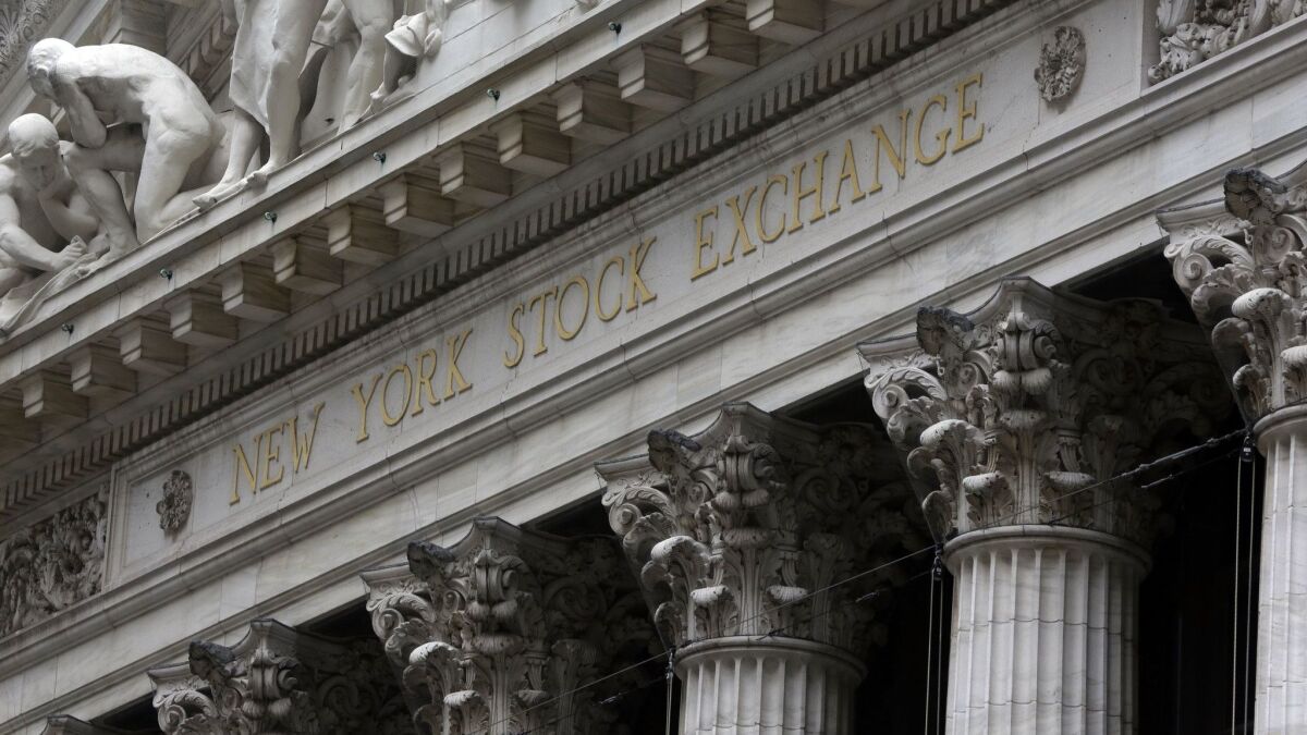 The facade of the New York Stock Exchange. Hourly earnings in the finance sector declined in September compared with the previous year.