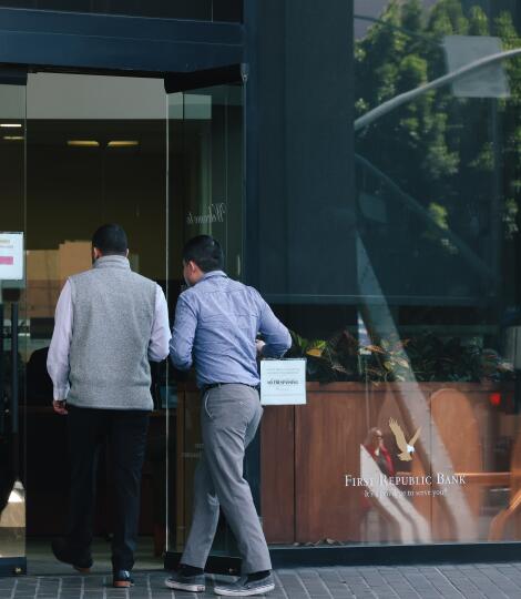 People enter the First Republic Bank in downtown Los Angeles on Monday.