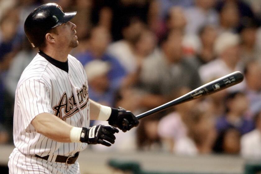 Houston's Jeff Bagwell watches the ball leave the park for a grand slam against San Diego on May 21, 2001.