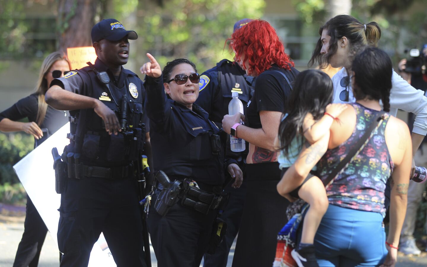 Chula Vista police prevent supporters of the Drag Queen Story Hour from entering the area where protesters against the story hour are at the Chula Vista Public Library, Civic Center Branch, on Tuesday, September 10, 2019 in Chula Vista, California.