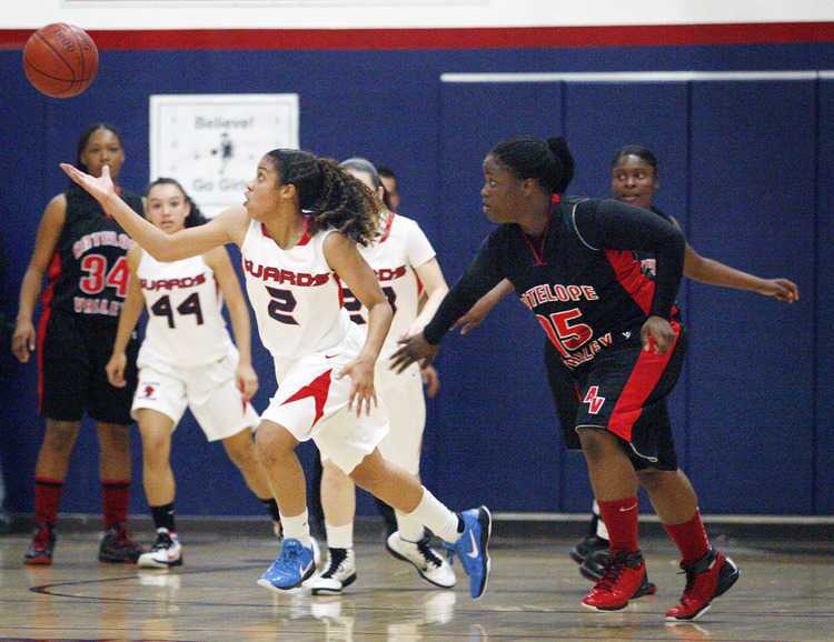 Bell-Jeff's Layana White, left, catches a loose ball, while Antelope Valley's Keiona Mathews tries to steal the ball from White during a game at Bellarmine-Jefferson High School in Burbank on Wednesday, February 23, 2011. Bell-Jeff wins against Antelope Valley 77-73.
