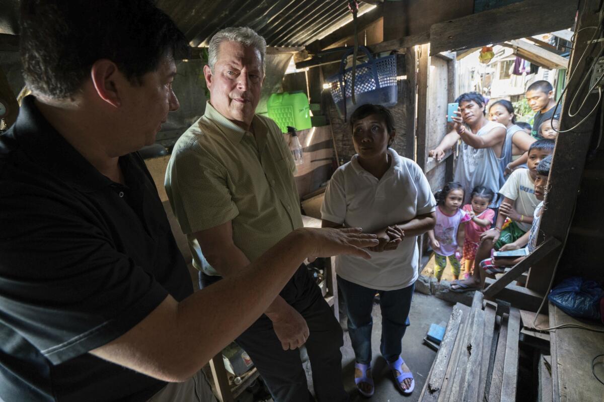 Former Vice President Al Gore, center, in a scene from "An Inconvenient Sequel."