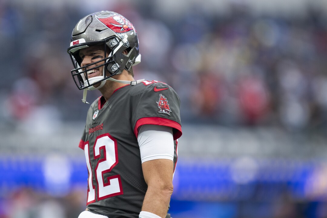 Tampa Bay Buccaneers quarterback Tom Brady smiles before a game against the Rams.