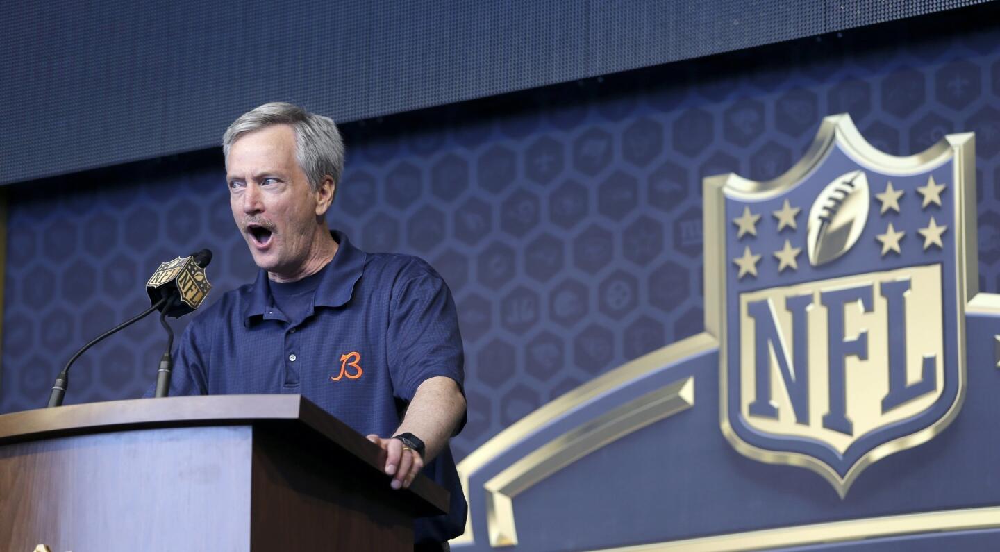 Bears Chairman George H. McCaskey hollers out for Bears fans during the last day of the draft.