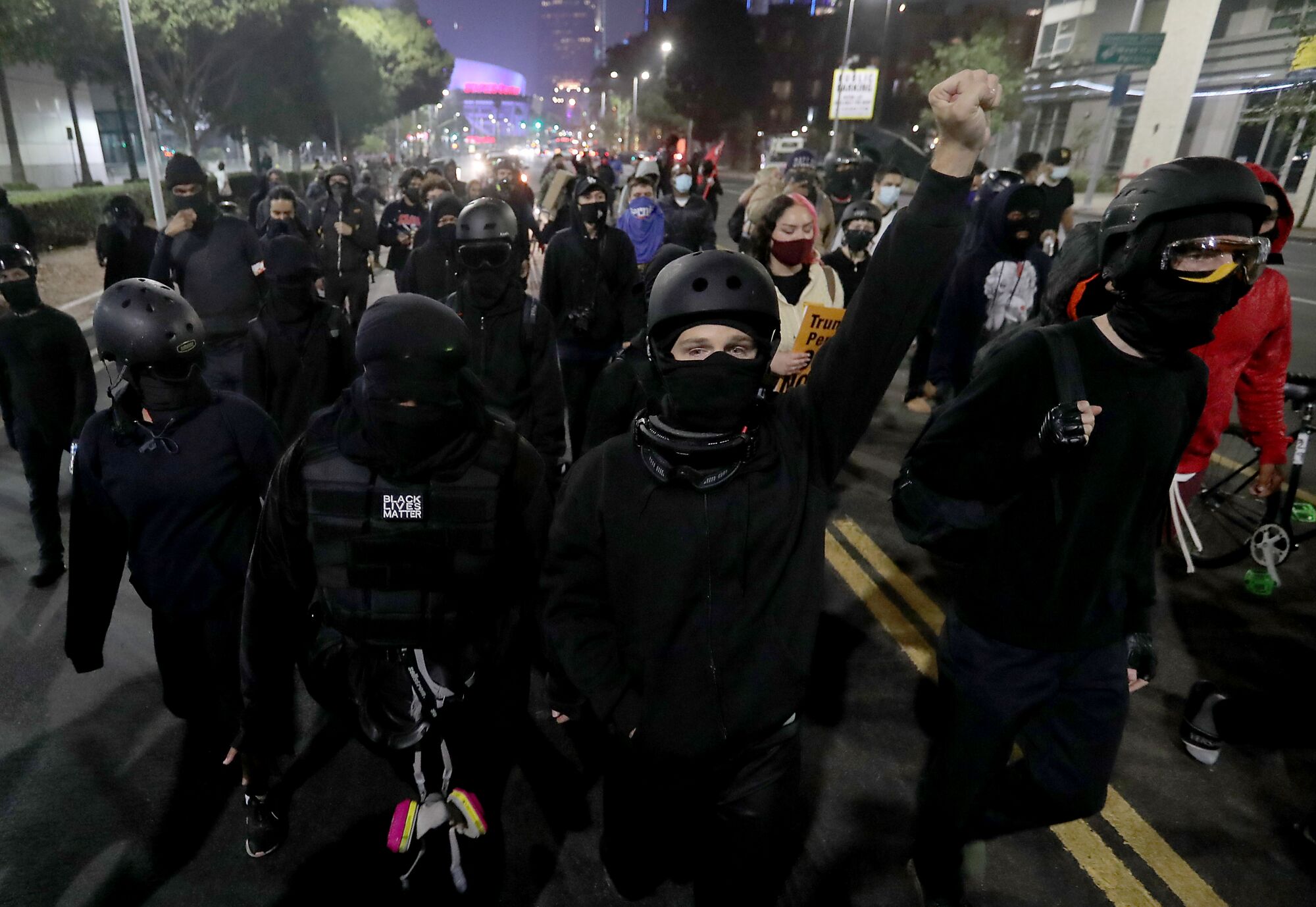 Protesters march down Figueroa Street in downtown Los Angeles on Tuesday night.