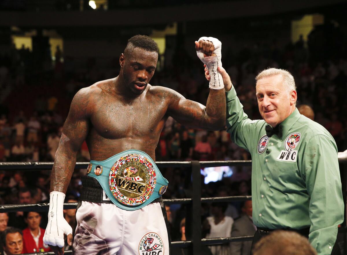 Deontay Wilder gets his hand raised after defeating Chris Arreola on July 16.