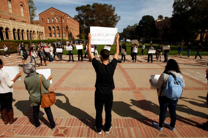 Students stand in front of UCLA’s Royce Hall to protest a university decision not to divest with companies that conduct business with Israel, on March 5, 2014.