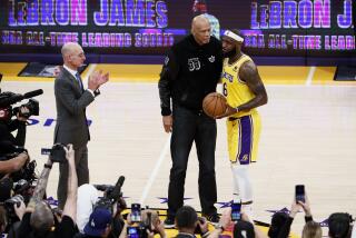 LOS ANGELES, CA - FEBRUARY 07: LeBron James, right, hugs Kareem Abdul-Jabbar after becoming the all-time NBA scoring leader, passing Kareem Abdul-Jabbar at 38388 points during the third quarter against the Oklahoma City Thunder at Crypto.com Arena on Tuesday, Feb. 7, 2023 in Los Angeles, CA. (Robert Gauthier / Los Angeles Times)