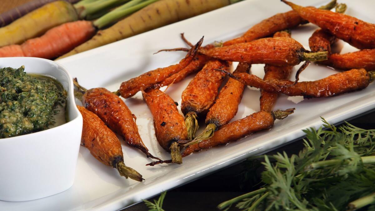 Roasted carrots with carrot top pesto.