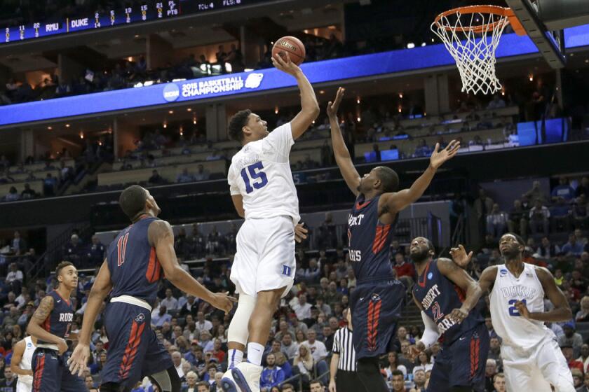 Duke's Jahlil Okafor shoots over a Robert Morris player during the first half of the NCAA tournament on Friday. The Blue Devils pulled away for an 85-56 victory.
