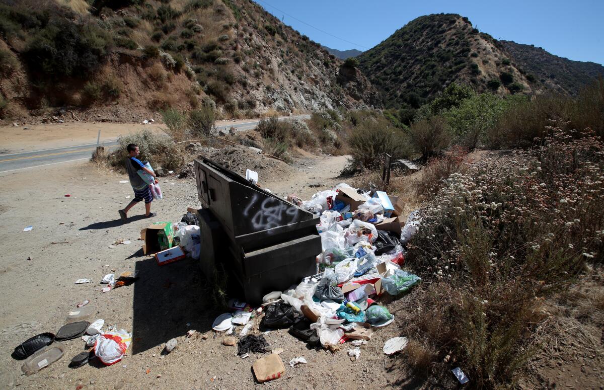 Trash piles up along the East Fork of the San Gabriel River 