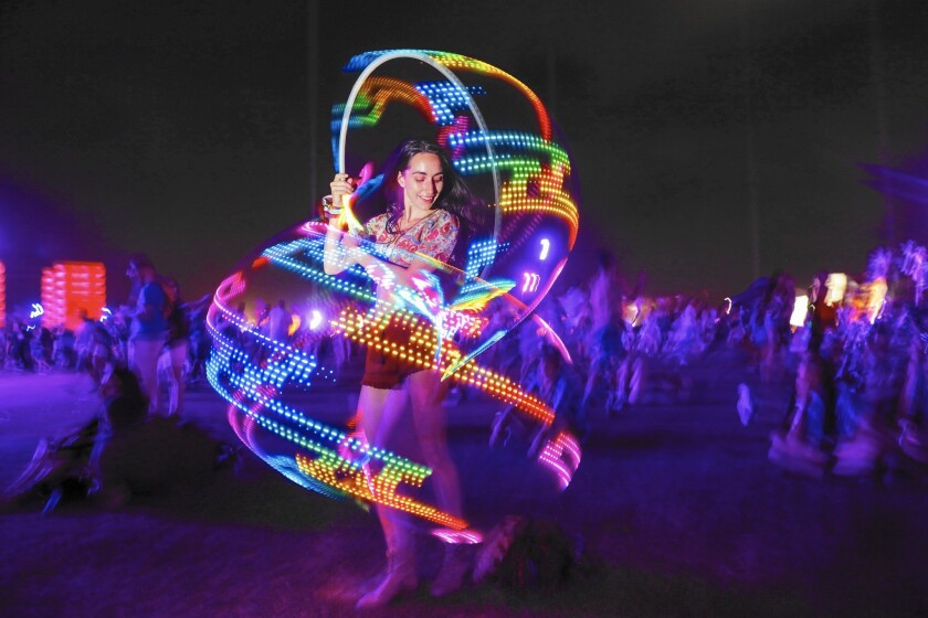 Megan Elischer of West Los Angeles, a member of the Go-Go Hoop Dance Stars in Los Angeles, dances to the sounds of LCD Soundsystem with her L.E.D.-lit hoop on Weekend 2 of the Coachella Valley Music and Arts Festival on the Empire Polo grounds in Indio on April 22, 2016.
