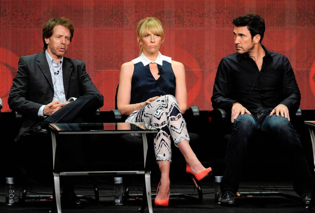 Producer Jerry Bruckheimer, left, and actors Toni Collette and Dylan McDermott participate in the "Hostages" panel at the TCA press tour.