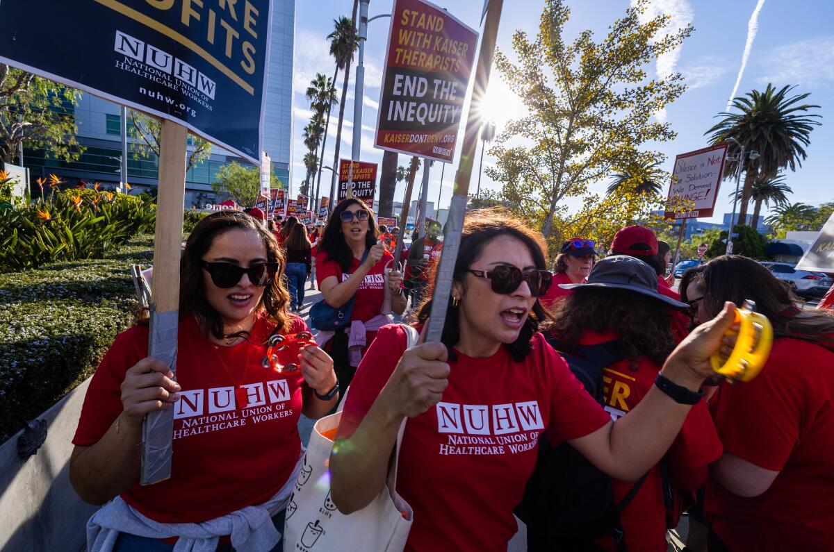 Psychologists, therapists and other mental health professionals who work for Kaiser Permanente walk a picket line.