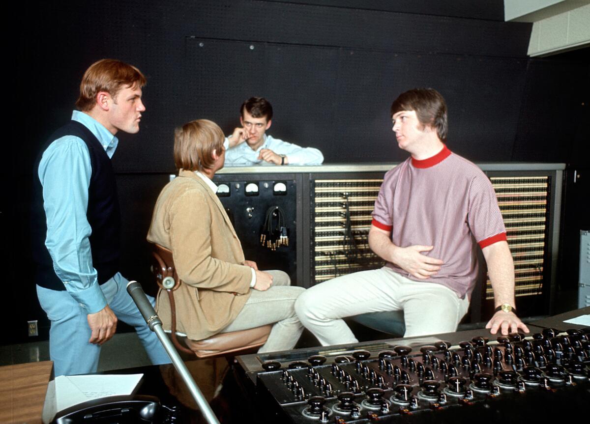 Brian Wilson, right, talks with Bruce Johnston, far left, and other band members in 1966 during the recording of "Pet Sounds." (Michael Ochs Archives / Getty Images)