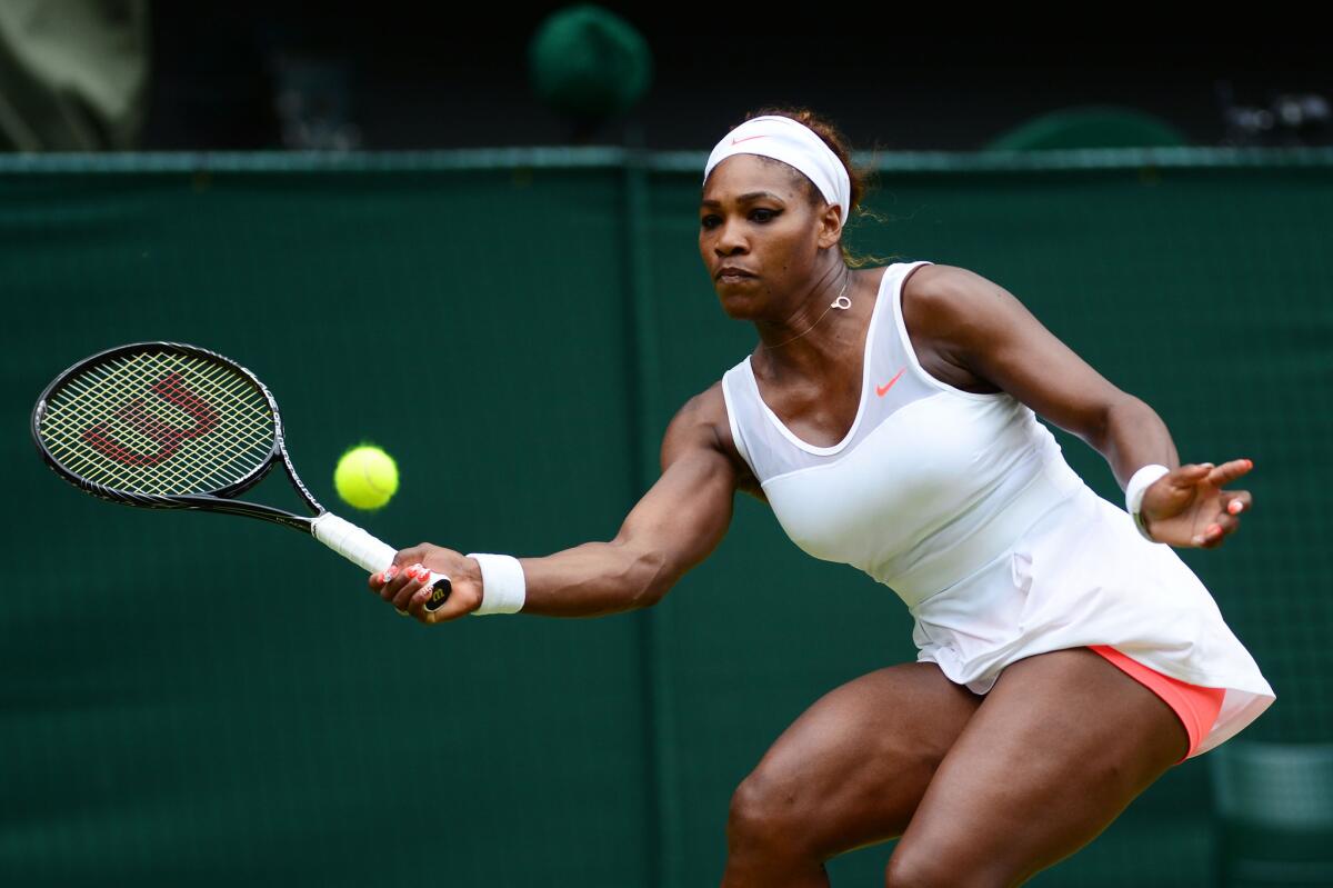 Serena Williams chases down a forehand shot during a match against Sabine Lisicki in last year's Wimbledon tournament.