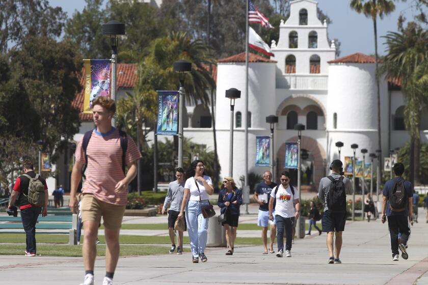 SAN DIEGO, April 24, 2019 | With Hepner Hall in the background, students walk on the San Diego State University campus in San Diego on Wednesday. | (Photo by Hayne Palmour IV / The San Diego Union-Tribune)