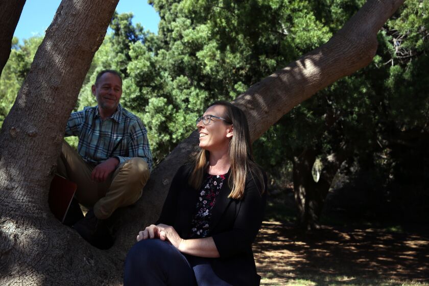 LOS ANGELES, CA-NOVEMBER 5, 2019: Parks and Recreations' Leon Boroditsky, left, and Urban Forester Rachel Malarich, right, sit on an Elephant Foot Tree in Elysian Park where the city's oldest trees were planted a century ago on November 5, 2019, in Los Angeles, California. (Photo By Dania Maxwell / Los Angeles Times)