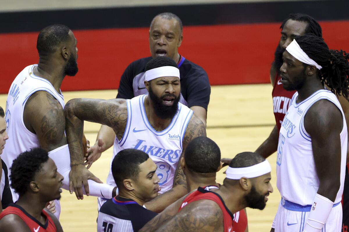 Lakers forward Markieff Morris chases after Rockets center DeMarcus Cousins after the two traded shoves.