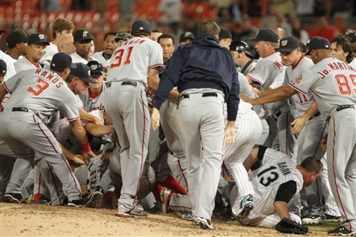 Atlanta Braves' Dan Uggla, right, puts his arm around Florida