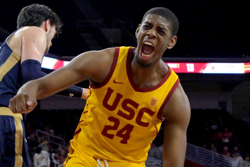 LOS ANGELES, CA - NOVEMBER 18: Joshua Morgan #24 of the USC Trojans reacts after a dunk.