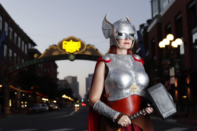 Colleen Rodriguez dressed as Marvel's Thor in San Diego's Gaslamp District. Rodriguez had her outfit made out of cotton, super suede and is 3D printed. She has been going to Comic-Con for 6 years, 4 years as vendor.