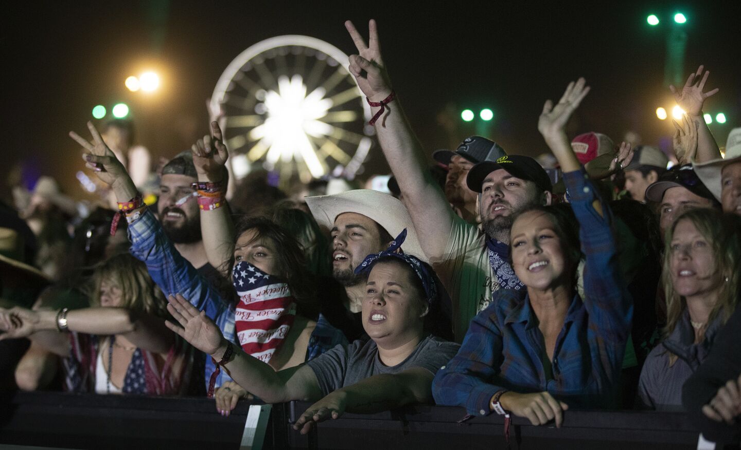 Fans show their approval as Garth Brooks performs on the Mane Stage at the Stagecoach country music festival.
